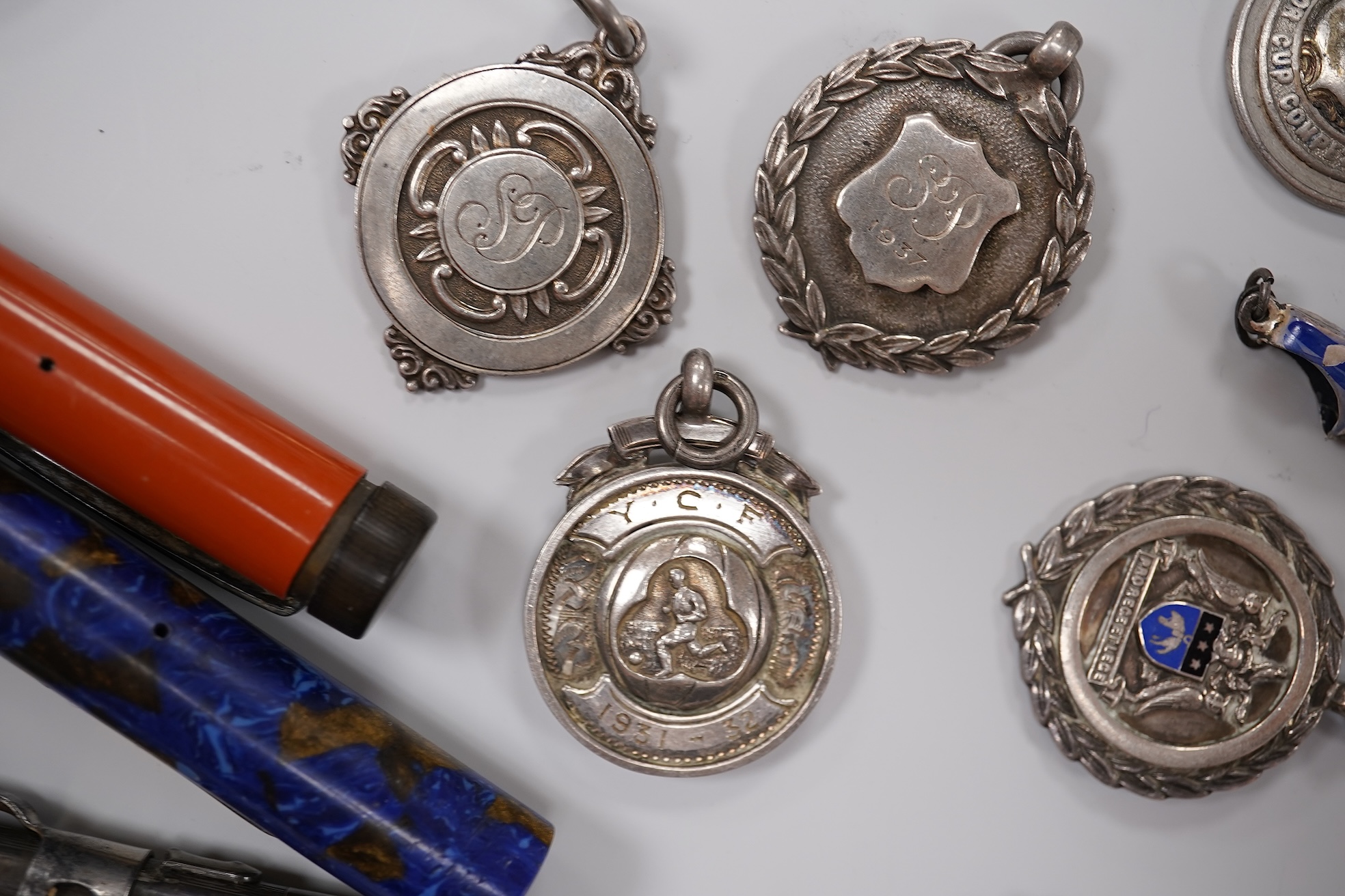An early 20th century yellow metal, amethyst and seed pearl set pendant, 41mm, on a yellow metal chain, together with other assorted jewellery and other items including a late Victorian 9ct gold brooch, a coin bracelet,